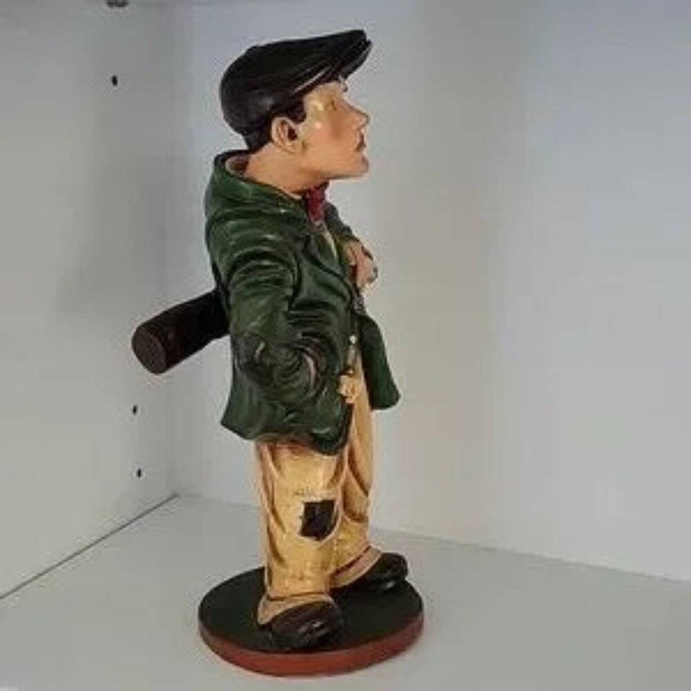 VINTAGE, "PETER MOOK", RESIN STATUE OF A GOLFER CADDYSTATUE.